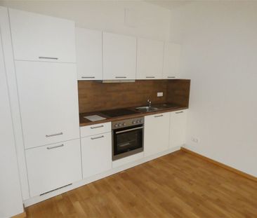 Toll geschnittene 2-Zi. Whg mit Balkon, Parkett, FBH, AR und TG! - Photo 1
