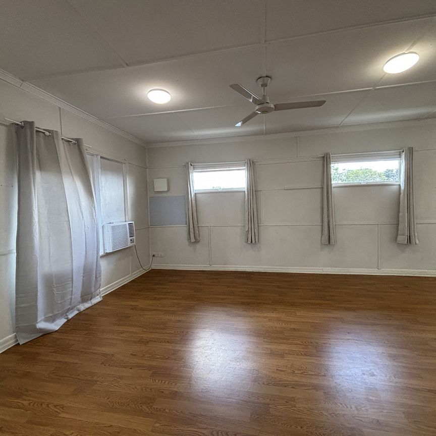 Upstairs Unit - Convenient Location with Electricity and Water included!! - Photo 1