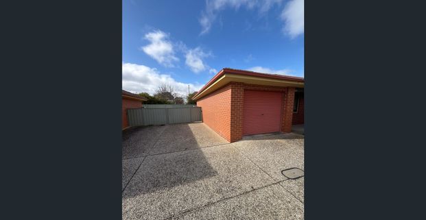 Tidy 2 bedroom unit with own backyard - Photo 1