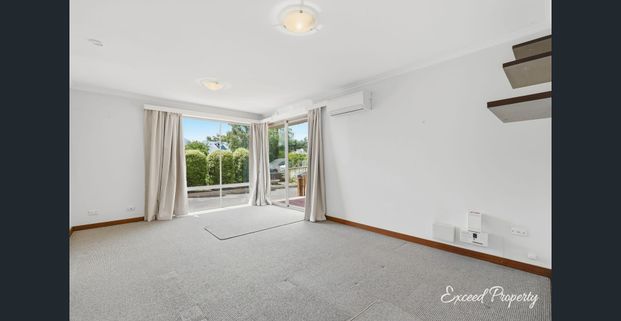 Comfortable Two-Bedroom Ground Floor Unit Near the Beach - Photo 1