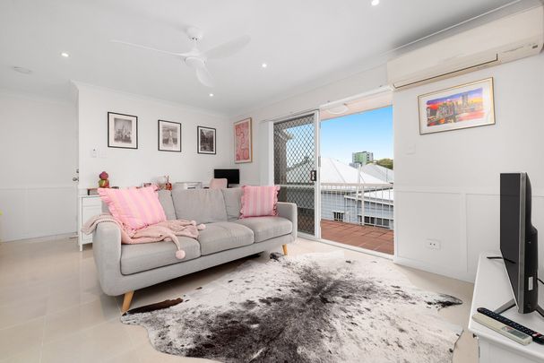 RENOVATED INNER-CITY RETREAT WITH BALCONY & LOCK-UP GARAGE - Photo 1