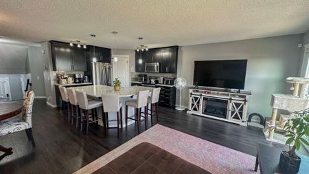 Stylish Auburn Bay Duplex With Garage & Newly Finished Basement - Photo 3