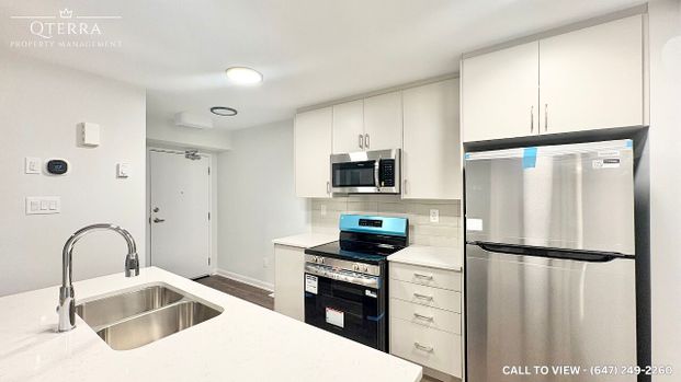 BRAND NEW 2-BEDROOM STACKED TOWNHOUSE WITH BEAUTIFUL FINISHES - Photo 1