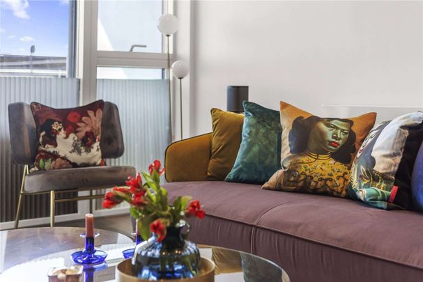 A contemporary two bedroom apartment to rent in a modern development in Kensal Rise boasting City skyline views. - Photo 1