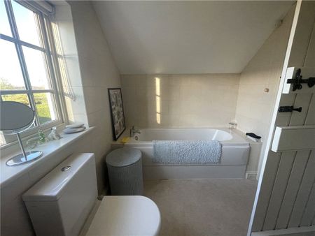 The Old School Rooms is a semi-detached cottage. It consists of a kitchen, utility room, living room with a multi-fuel stove, bathroom, downstairs WC and two bedrooms. The property benefits from oil central heating, off road parking and an enclosed rear garden. - Photo 4