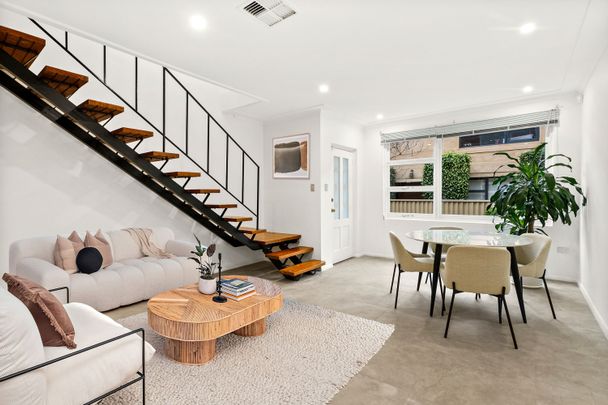 Dual-Level Townhouse In An Ideal Location - Photo 1