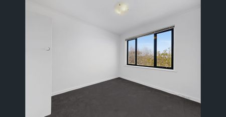 Spacious Top-Floor Apartment with Brand-New Updates Throughout - Photo 3
