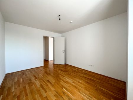 Helle DG-Wohnung mit großer Terrasse im Viola Park - Photo 5