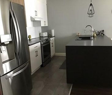 5 1/2 condo locatif - rez de chaussée - Photo 1