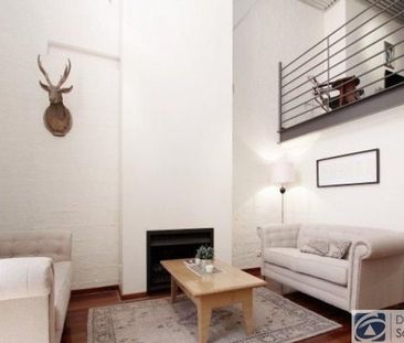 Stunning tri-level townhouse in historic warehouse conversion - Photo 2