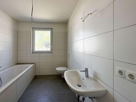 Ansprechende Maisonette-Wohnung mit Balkon | Fußbodenheizung | Stellplätzen | Luft-Wärme-Pumpe - Foto 4