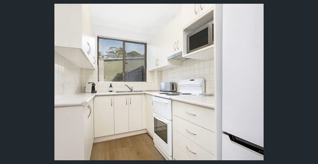 Quietly positioned at rear, bright 1 bedder with huge patio - Photo 1