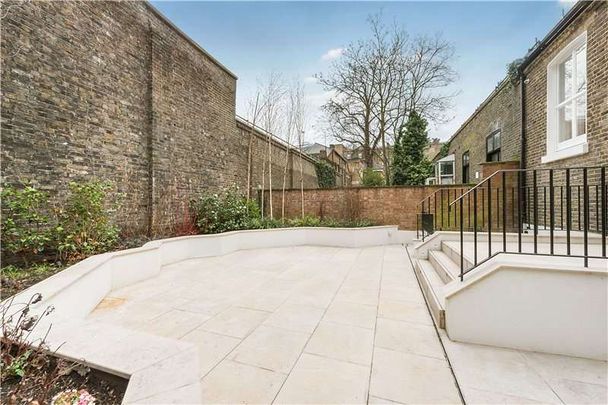 A Masterfully Refurbished Six-Bedroom Townhouse on Cranley Place - Photo 1