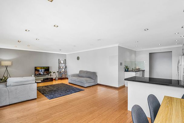 Beautifully Presented, Light Filled Home in a Sought-After Location! - Photo 1