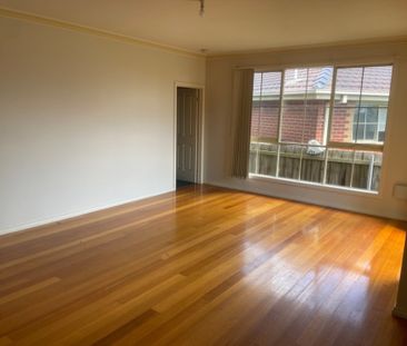 Charming Three-Bedroom Unit in Tranquil Court Location! - Photo 2