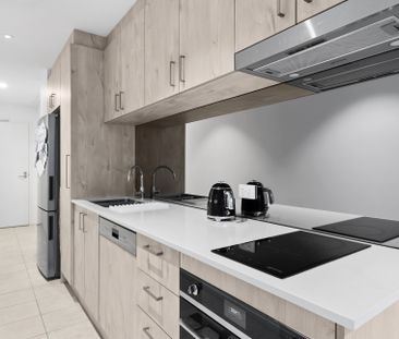 Contemporary 1-Bedroom Apartment in Vibrant Lifestyle Complex! - Photo 4