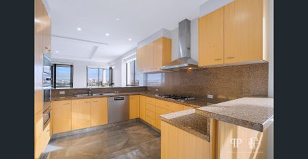 Sophisticated Riverside Penthouse with Iconic Story Bridge & City Skyline Views - Photo 5