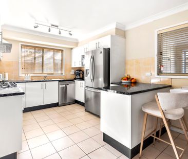 Spacious Three-Bedroom Home with Multiple Living Areas & Excellent ... - Photo 6