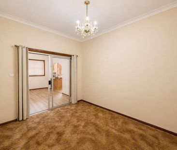 Spacious Family Home with Utilities & Lawn Maintenance Included - Photo 3