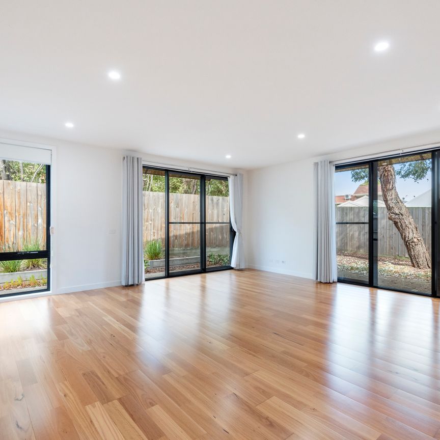 Modern Two-Story Brick Townhouse with Stylish Features - Photo 1