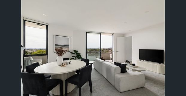 Sleek Top-Floor Sanctuary With City Skyline Vistas - Photo 1