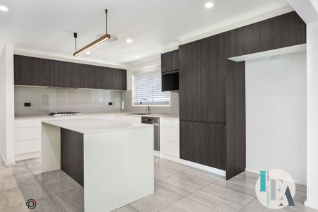 Modern 4-Bedroom Family Home in Prime Albion Park Location - Photo 3