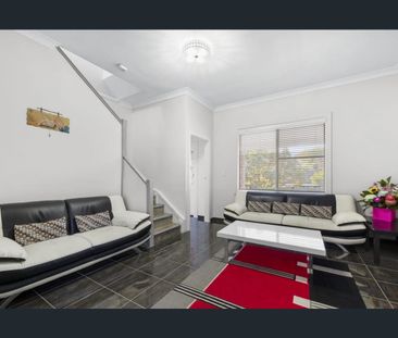 Stylish Two-Level Living in a Prime South-East Location - Photo 1