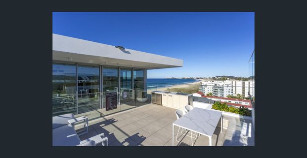 Beachfront Living with Ocean Views & Rooftop Pool - Photo 1