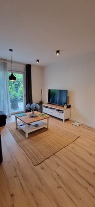 Przestronne mieszkanie z ogrodem i garażem - Zdjęcie 1