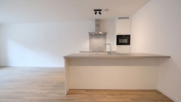Gelijkvloers nieuwbouwappartement met tuin - Photo 1