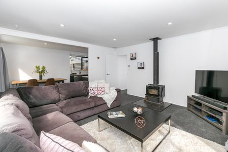 This beautifully refreshed four-bedroom, single-bathroom home offers modern living in a prime Nawton location. - Photo 3