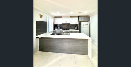 FOR RENT – Spacious Modern Family Home with Full Backyard Deck - Photo 4