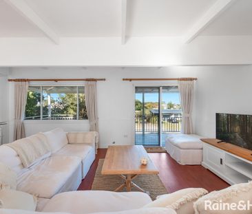 Fully Furnished Coastal Retreat with Flexible Dual Living - Photo 1