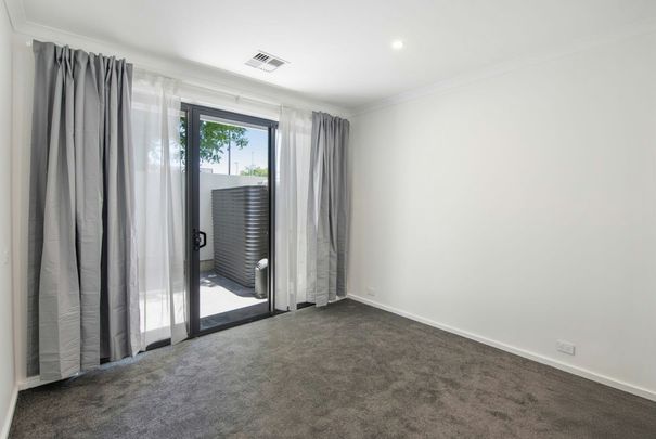 Stylish Three-Level Townhouse with Contemporary Comfort - Photo 1