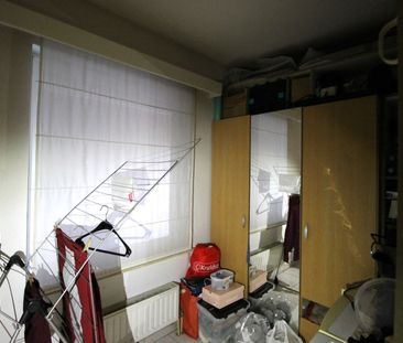 Een gelijkvloers appartement met 2 slaapkamers, tuin en garage. - Foto 3