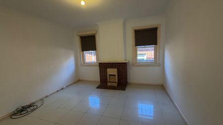 Spacious 4-Bedroom Home with Large Backyard & Separate External Cabin - Photo 5