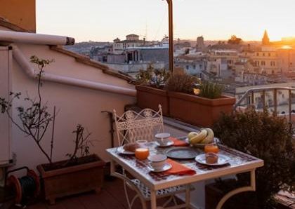 Attic-Monti: 1-6 month rentals. Spacious, furnished 3 Bedroom, 2 bath, living room, dining room, study and large panoramic terrace. Bright, silent, located in well kept Palazzo d’Epoca with elevator and doorman. Near transport and Metro.