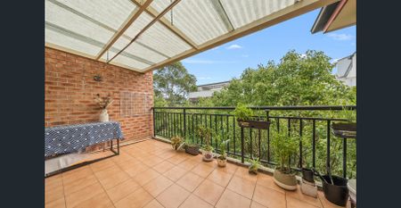 Full Brick Split-Level Unit with Fresh Paint, Modern Upgrades & A/C - Photo 4