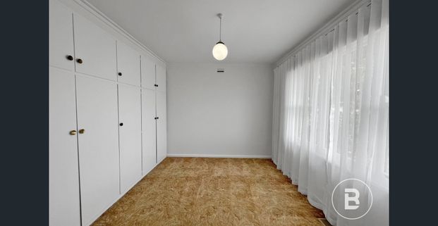 RECENTLY UPDATED THREE BEDROOM HOME WITH SHEDDING - Photo 1