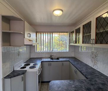 Two Bedroom Top Floor Unit - Photo 3