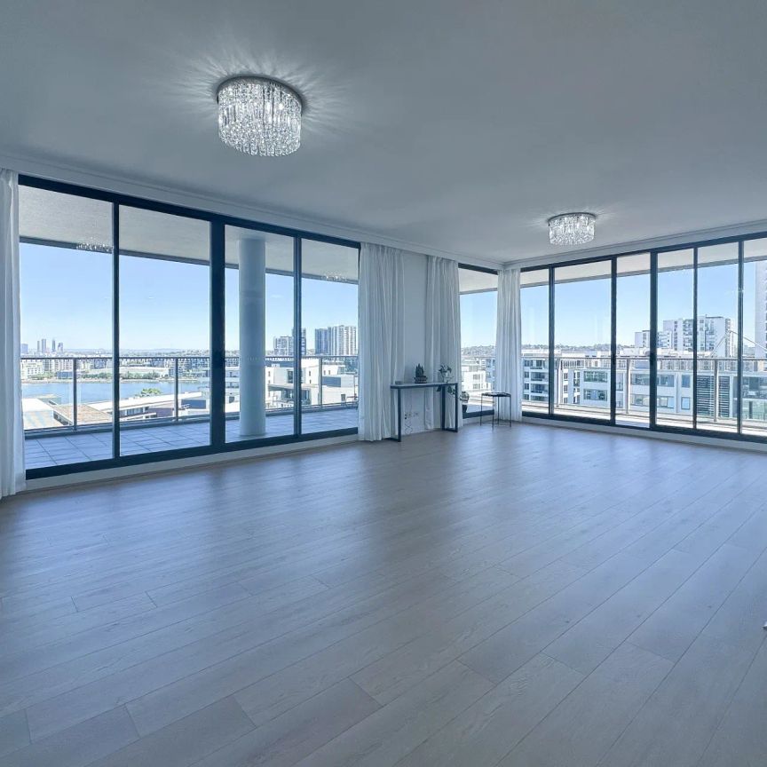 Luxury Apartment with Spectacular Water Views | Top Floor of Complex - Photo 1