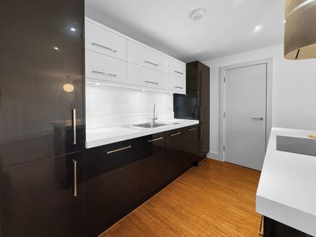 Situated along the High Street overlooking a private communal garden, this modern 2 bedroom flat offers a large balcony, open plan living/dining/kitchen area and allocated parking. - Photo 2