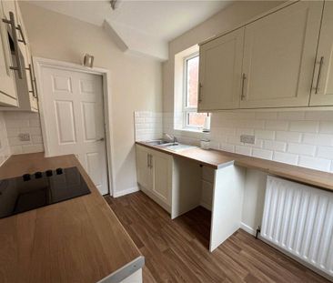 A three bedroom semi-detached family home with driveway parking and... - Photo 3
