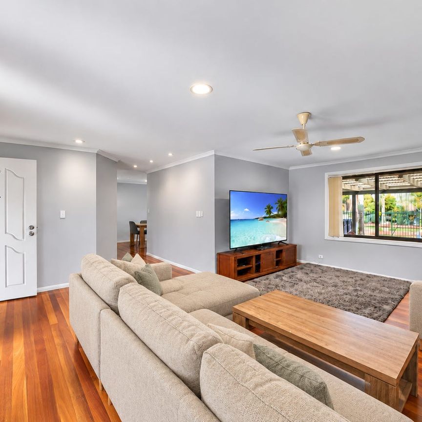 Spacious Family Home with New Carpets, Massive Pool & Outdoor Entertaining! - Photo 1