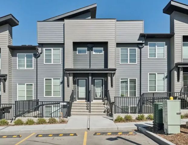 Exquisitely Furnished Walkout Apartment | 312 - 260 Rowley Way Northwest, Calgary - Photo 1