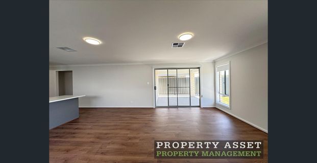 Modern Three-Bedroom Home in a Quiet Hills Location with SOLAR and Second Living Area - Photo 1