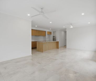 BRAND NEW FAMILY HOME WITH THREE LIVING AREAS! - Photo 1