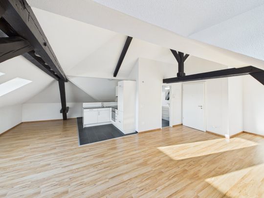 Charmante 1.5-Zimmer-Dachwohnung im Herzen von St. Gallen - Foto 1