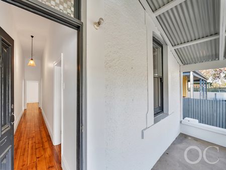 Open the Door to Coastal Charm with Modern Comfort - Photo 5