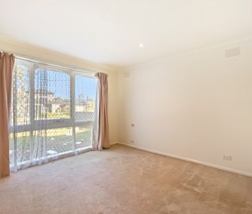 Comfortable Family Living in a Spacious Brick Home - Photo 1